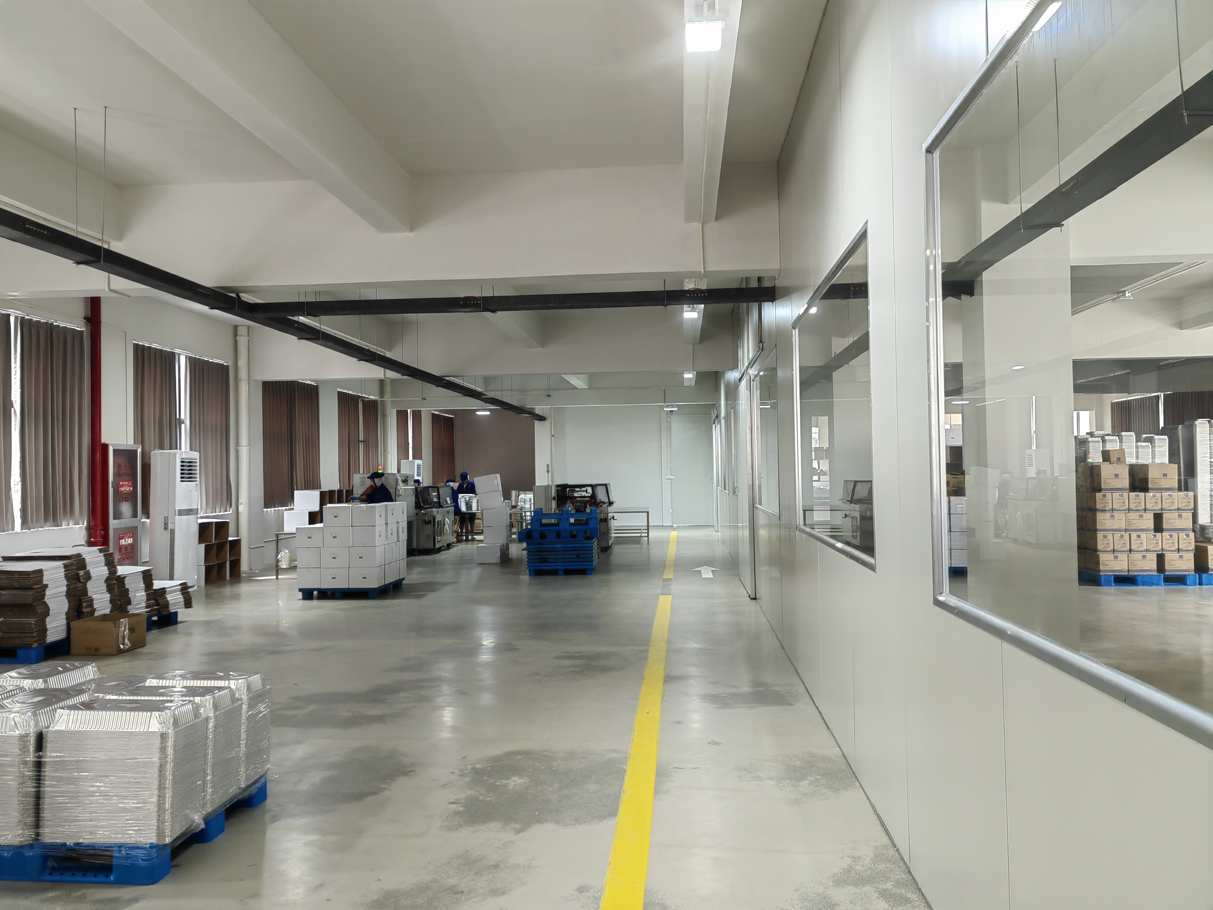 Finished goods and cartons arranged beside the workshop clean room
