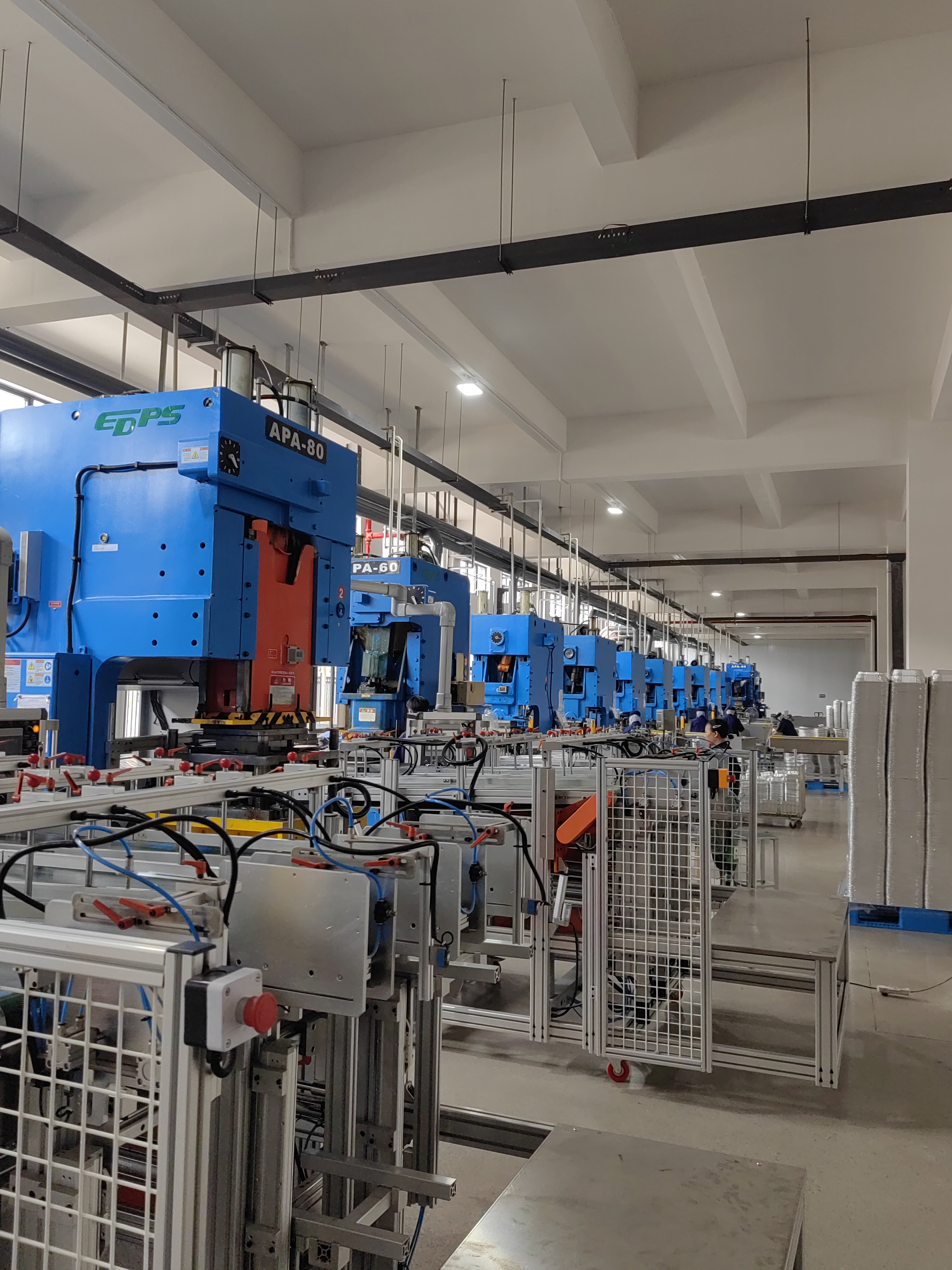 Blue aluminum foil container press machines arranged in production line